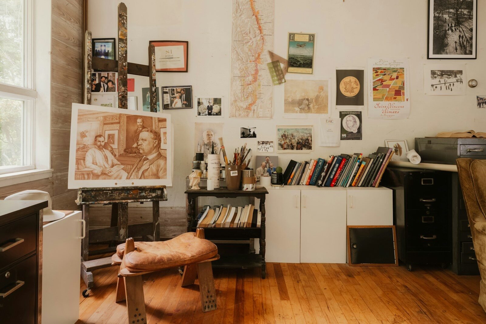 Creative artist's studio with easel, painting, and art supplies